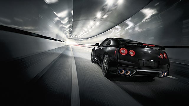 2023 Nissan GT-R seen from behind driving through a tunnel | Briggs Nissan in Manhattan KS